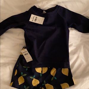 Rashguard and swim trunks